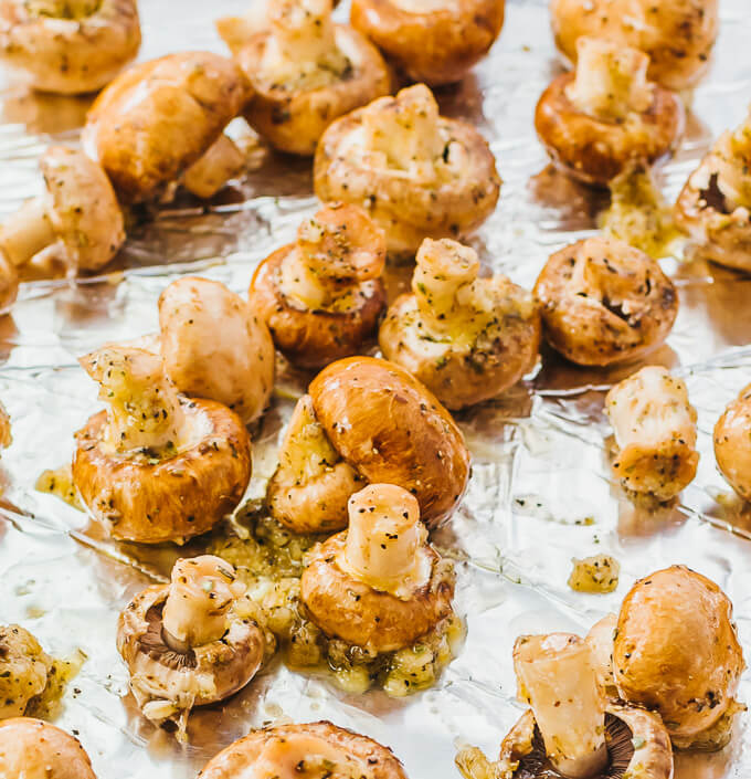 mushrooms spread out on baking sheet