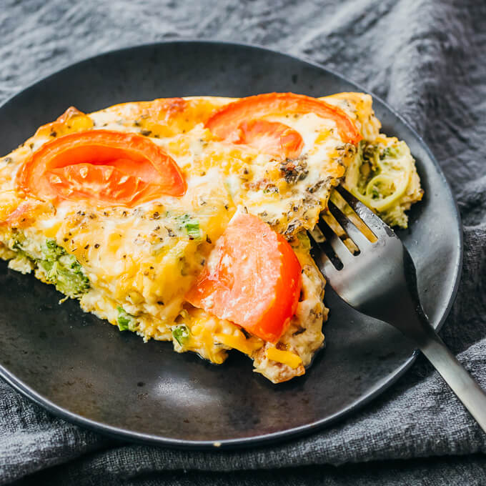 slice of quiche served on black plate