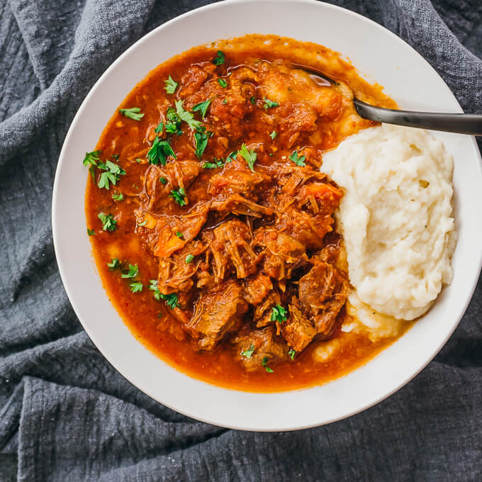 overhead view of beef ragu in white bowl