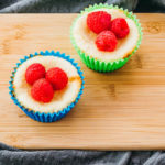 mini cheesecake bites topped with raspberries