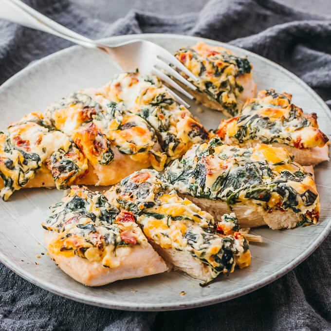 cutting baked chicken breasts into small pieces