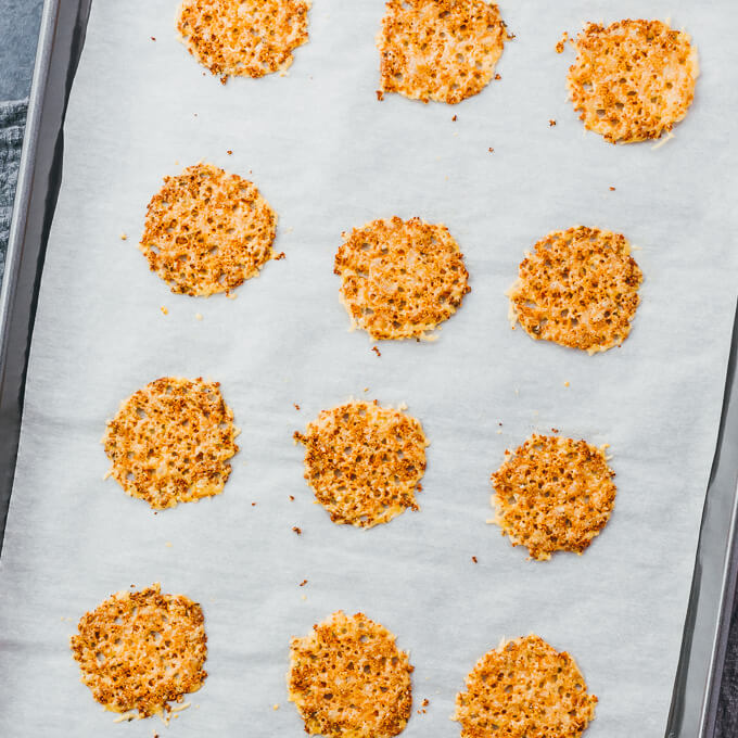 baked parmesan crisps on parchment paper