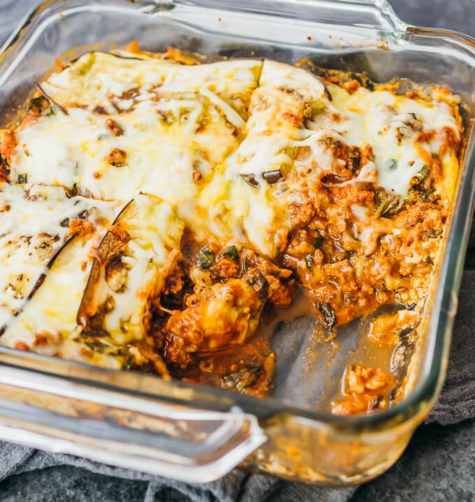 partial eggplant lasagna in glass casserole dish