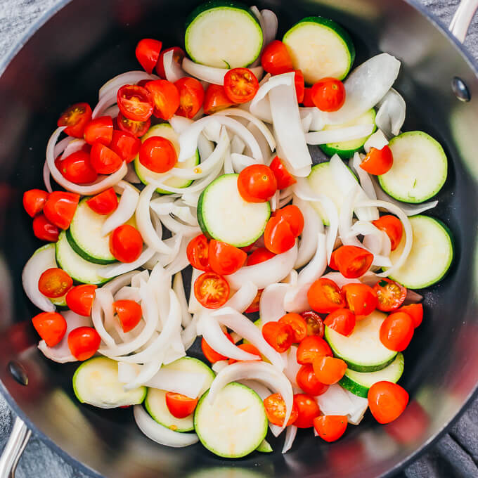 chopped raw vegetables in black pot