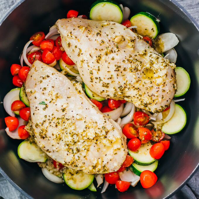 marinated chicken and vegetables in black pot