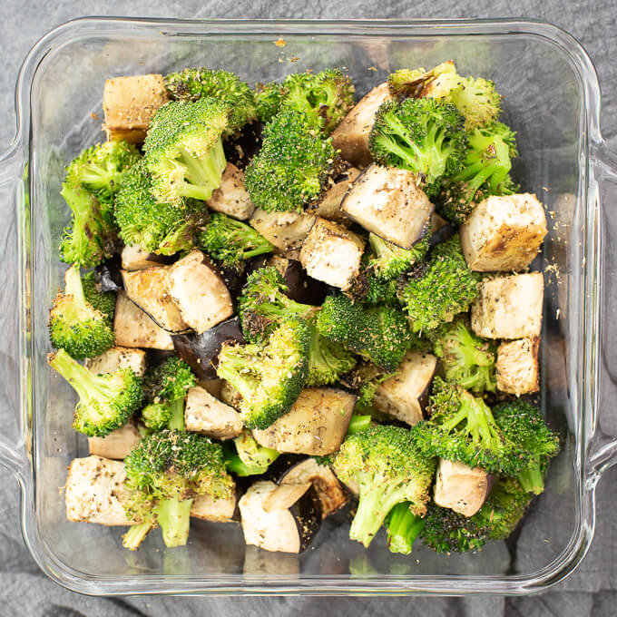 adding broccoli and eggplant to casserole dish