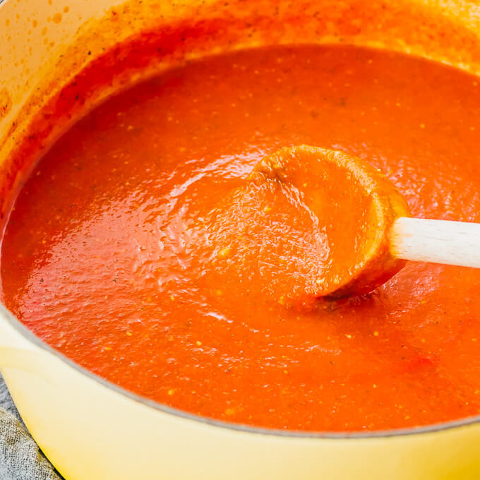 making tomato soup in yellow dutch oven