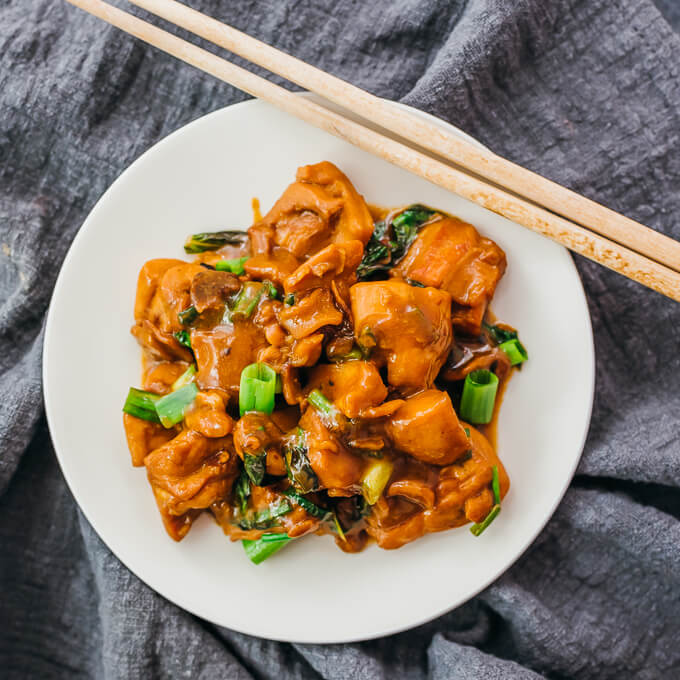 overhead view of chinese chicken with chopsticks