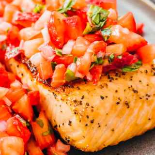 pan seared salmon fillet topped with strawberry relish