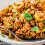 ground beef picadillo in white bowl