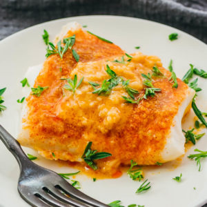 closeup view of baked cod on plate