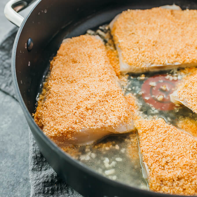 parmesan covered cod fillets in pan