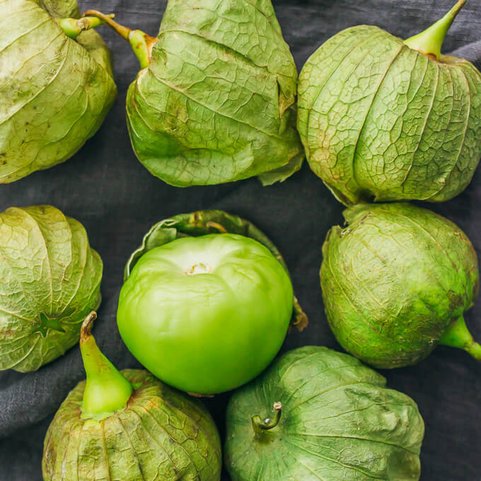 removing the husks from tomatillos