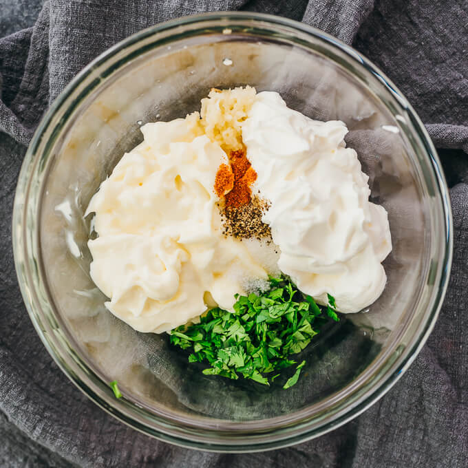 keto ranch dressing ingredients in a glass bowl
