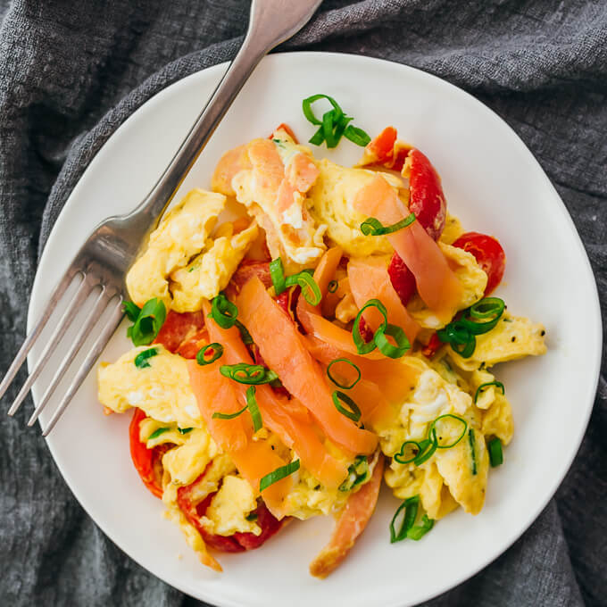 smoked salmon scrambled eggs served on white plate