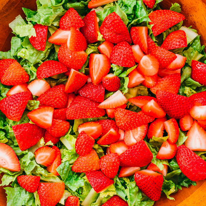 quartered strawberries and romaine lettuce