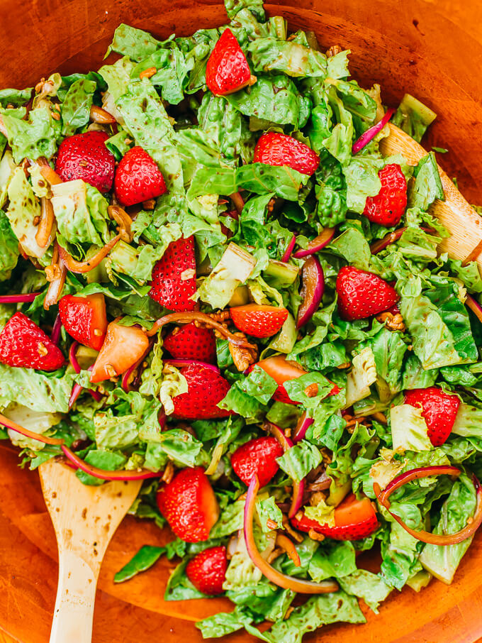 stirring strawberry salad ingredients