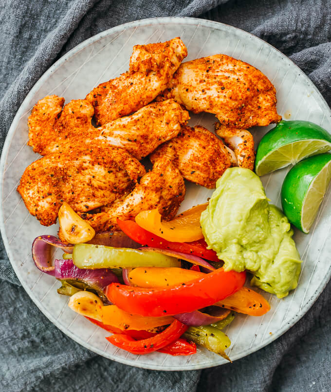 chicken fajitas served on plate with guacamole