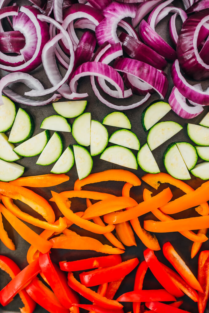 sliced vegetables on baking sheet