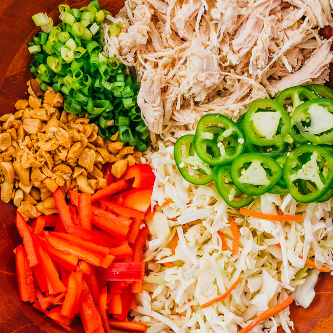 thai salad ingredients in wooden bowl
