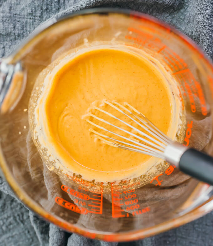 whisking together peanut sauce