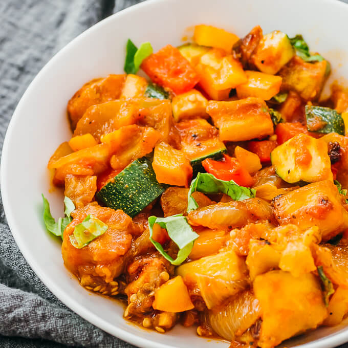 close up view of ratatouille in white bowl