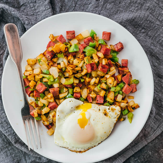 overhead view of corned beef hash with fried egg