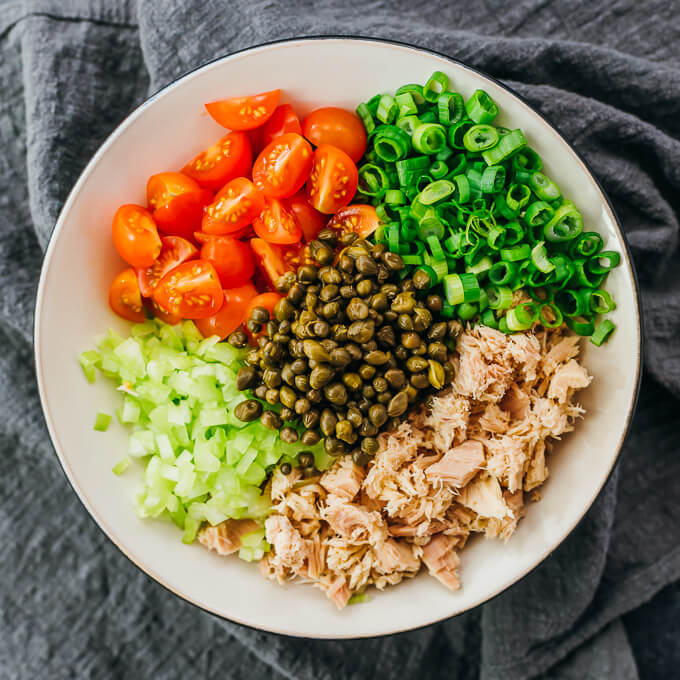tuna salad ingredients in white bowl