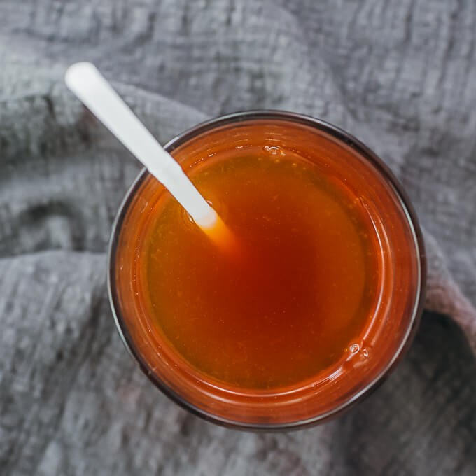overhead view of iced tea with straw