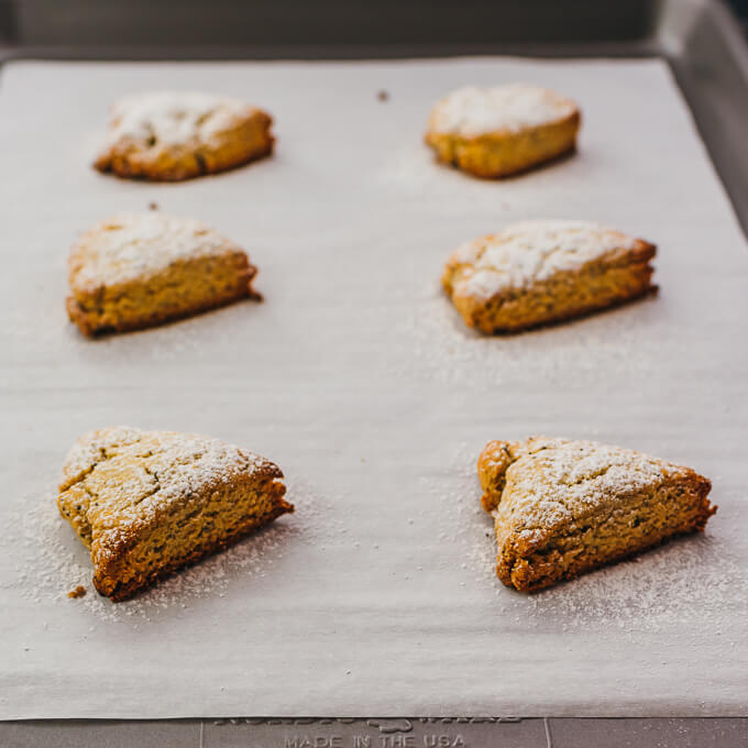 dusted keto scones on baking sheet