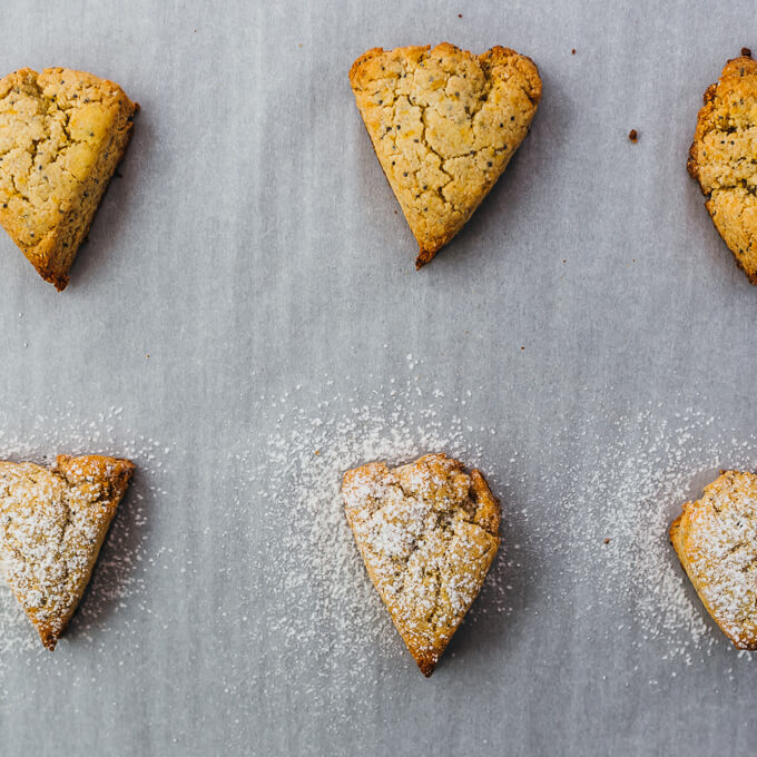 dusting freshly baked keto scones