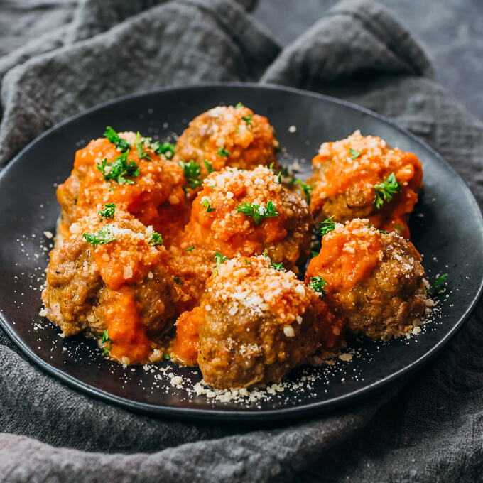 meatballs sprinkled with parmesan cheese