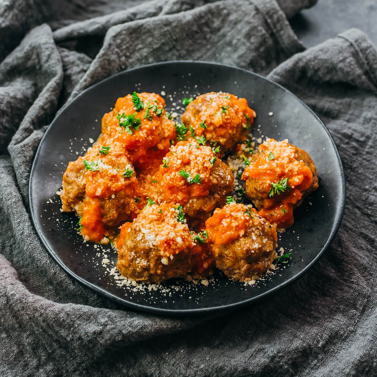 meatballs with sauce on black plate