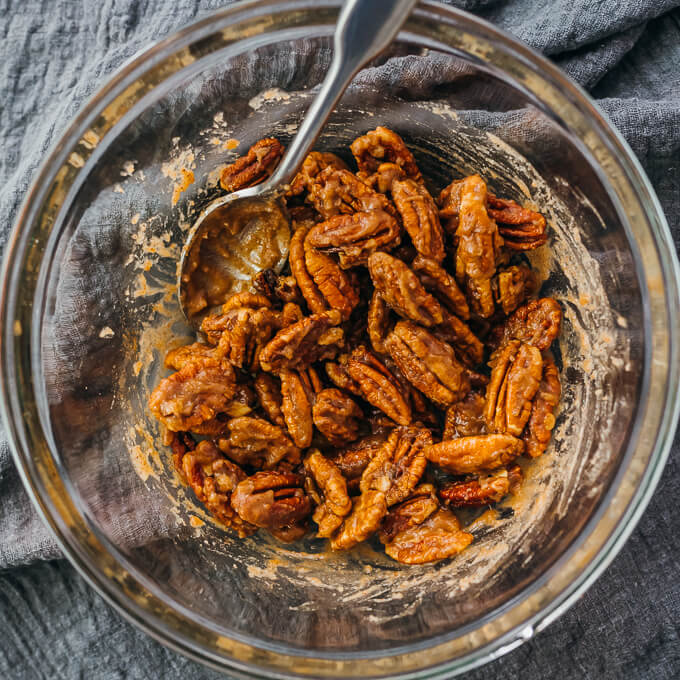 coating pecans with sweet cinnamon mixture