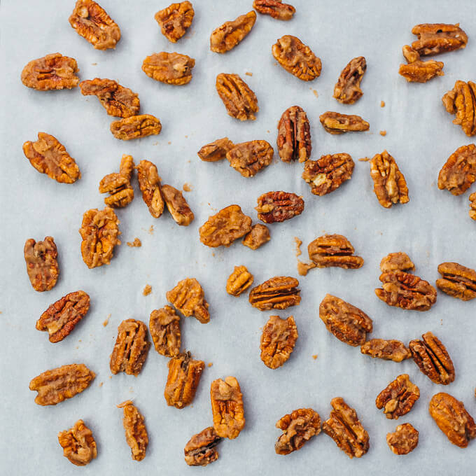 spreading out pecans on baking sheet