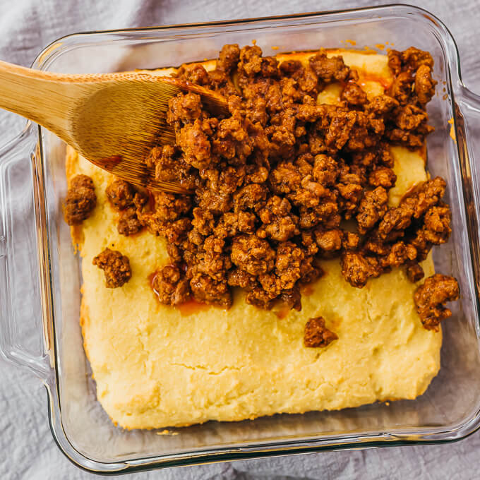 sloppy joes spread over cornbread