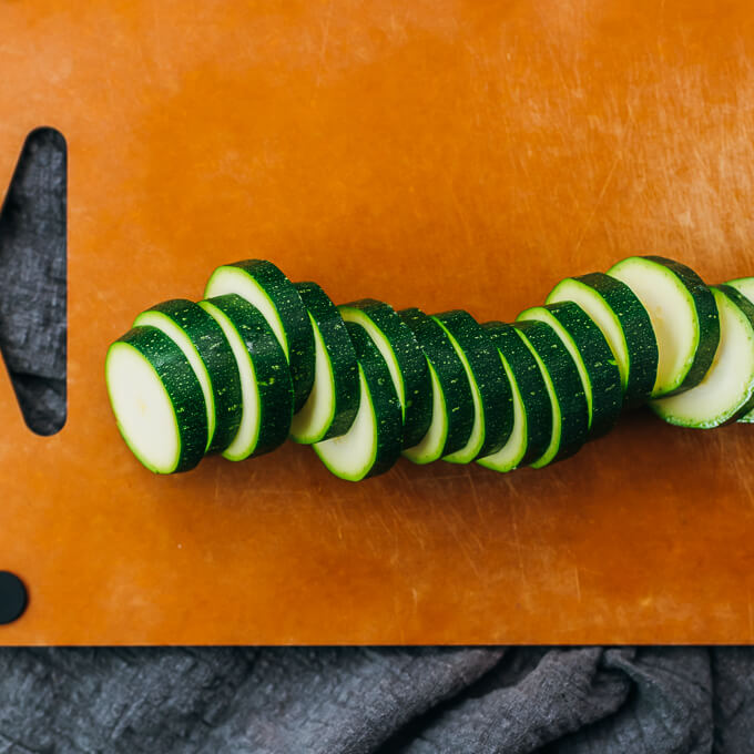 sliced zucchini on cutting board