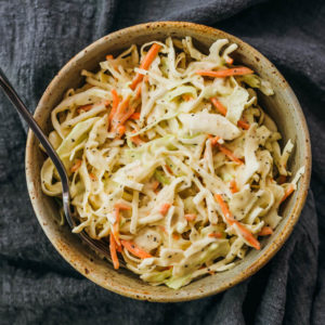 overhead view of keto coleslaw served in stoneware bowl