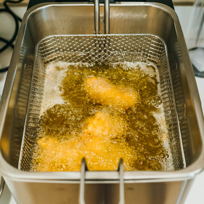 cooking fried chicken in deep fryer