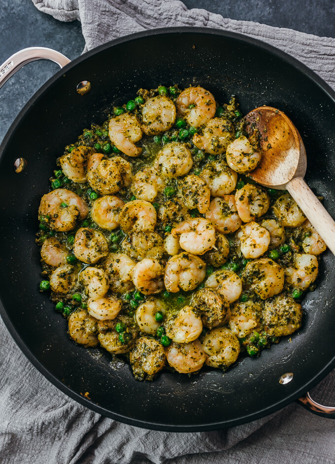 overhead view of pesto shrimp in black skillet