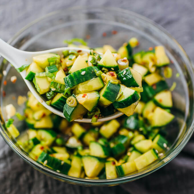 scooping up asian cucumber salad