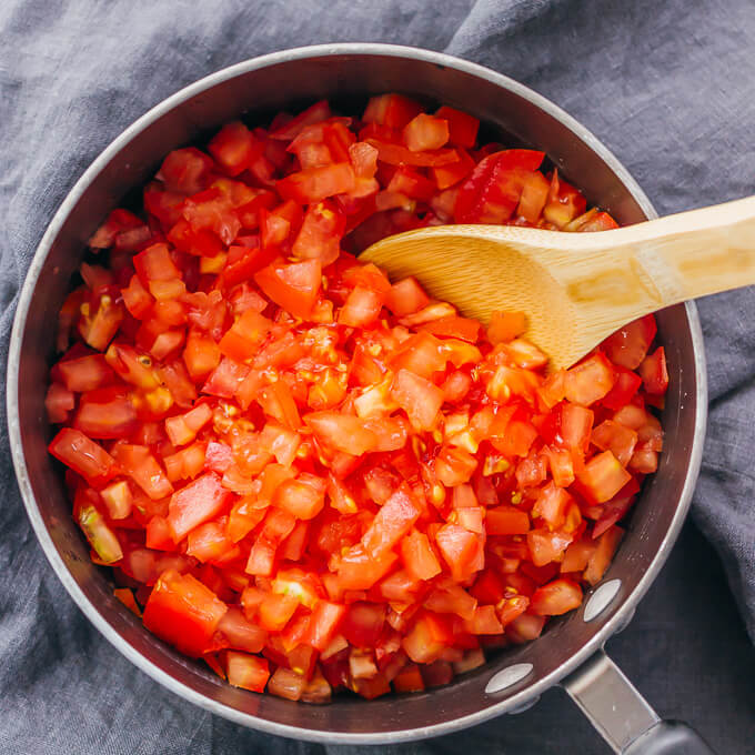 chopped tomatoes in saucepan