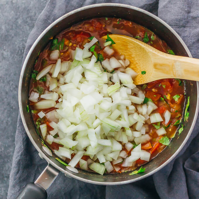 adding onions to saucepan