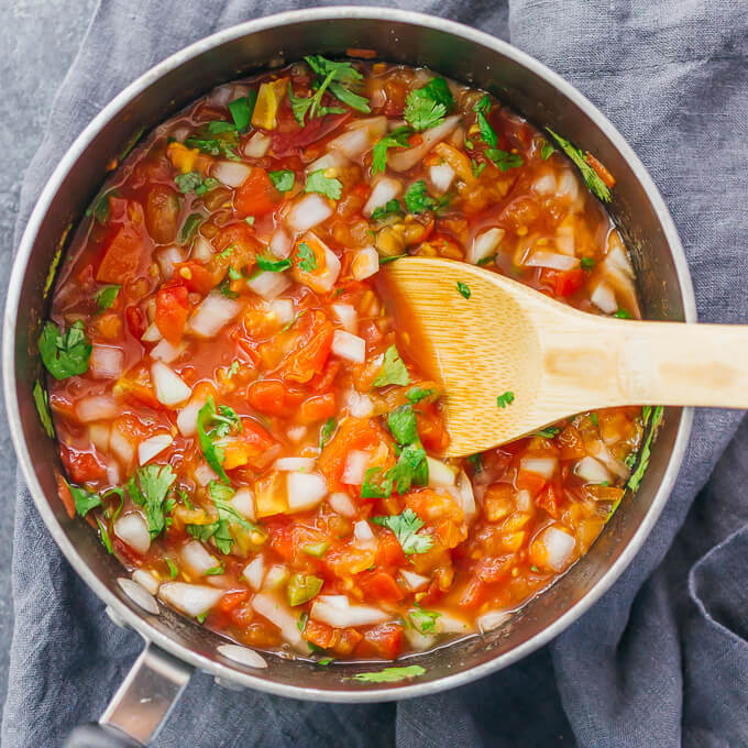 stirring fresh salsa mixture in saucepan