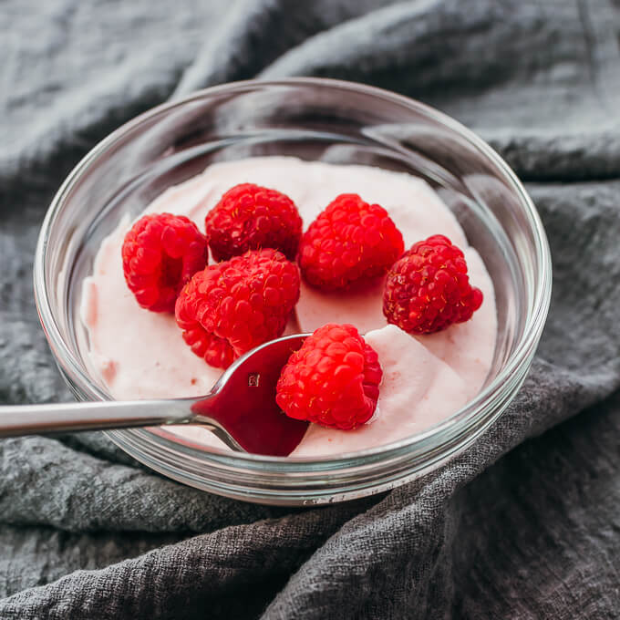 keto raspberry mousse spooned up