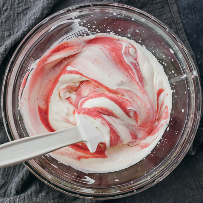 folding raspberry mixture into whipped cream