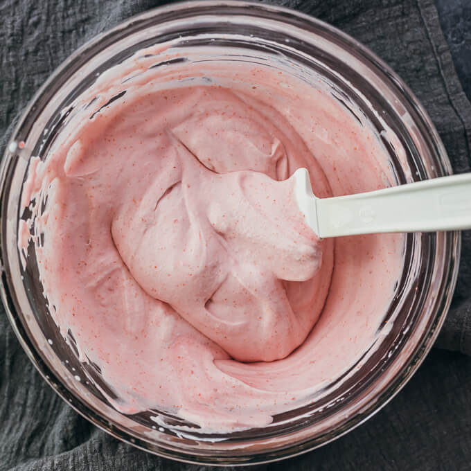 folded raspberry mousse in glass bowl