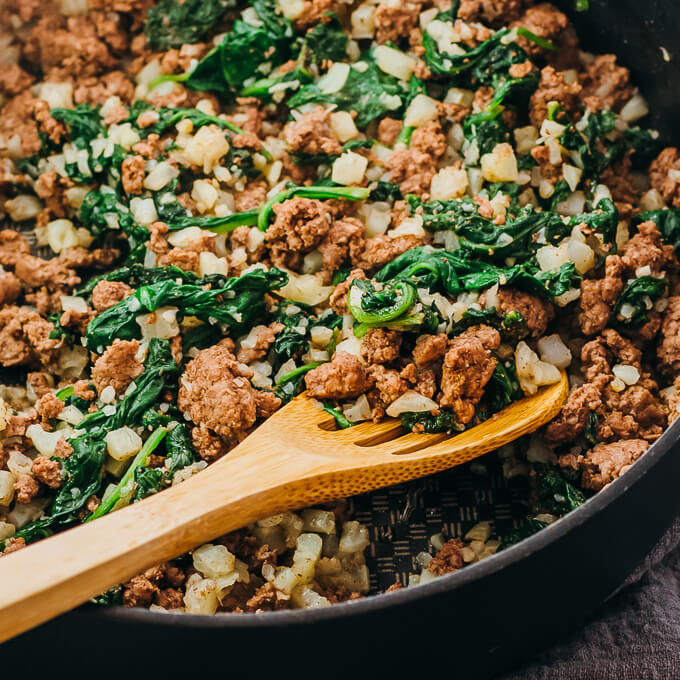 close up view of ground lamb in black pan