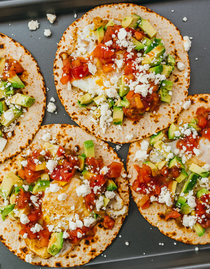 assembling huevos rancheros on tray