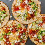 assembling huevos rancheros on tray